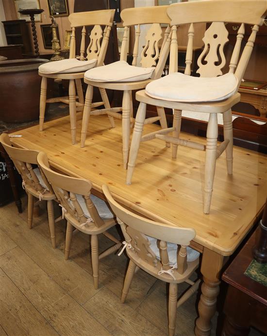 A pine kitchen table and six beech chairs L.180cm